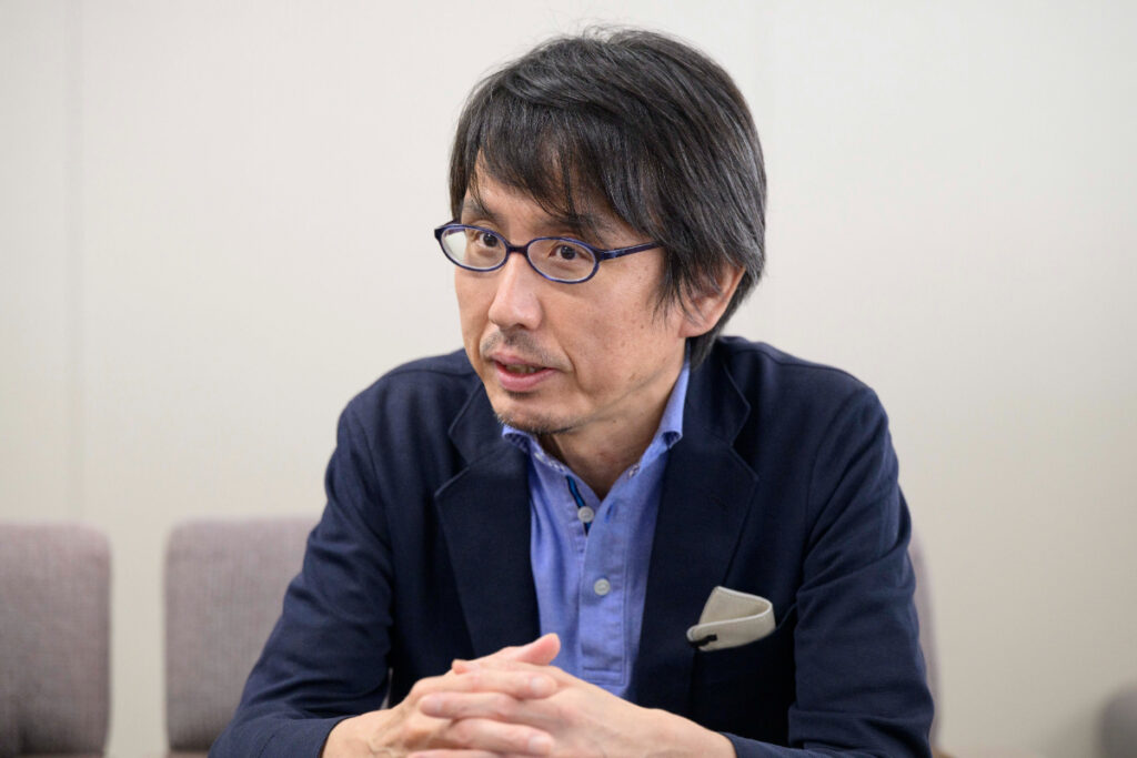 写真：インタビューに応じるティーガイアの木本さん