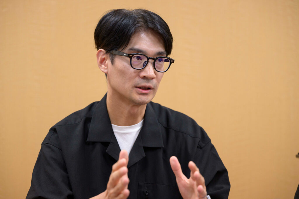 写真:インタビューに応じるTOPPANデジタルの原井さん